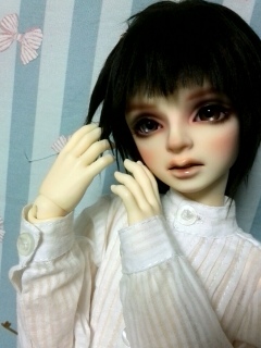 ���߂���